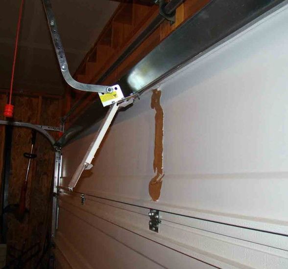 Wayne Dalton Center Support broken torque master system
