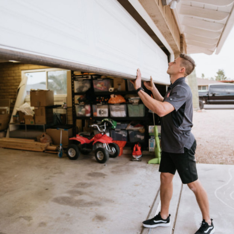 guy pulling garage door