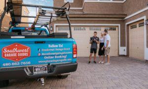 Book-with-Southwest-Garage-Doors guy opening garage door